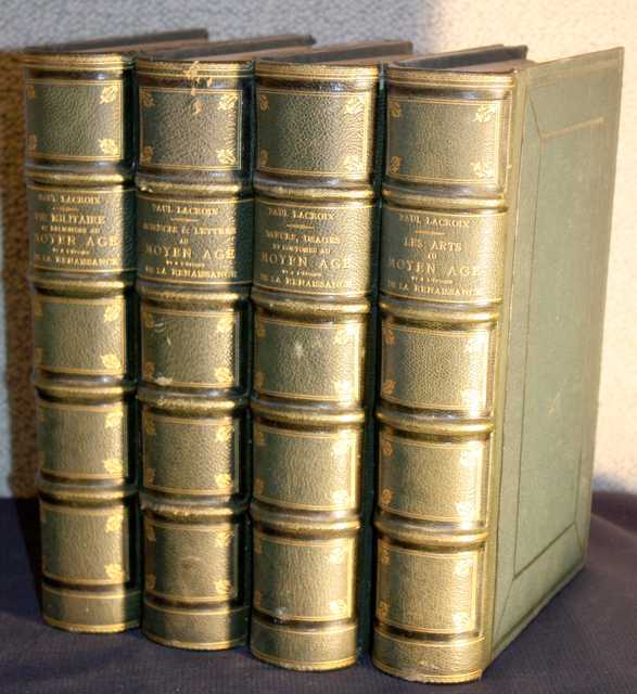 SERIE DE 4 VOLUMES PAR PAUL LACROIX COMPRENANT : VIE MILITAIRE ET RELIGIEUSE AU MOYEN AGE ET A L'EPOQUE DE LA RENAISSANCE (PARIS,1876), LES ARTS AU MOYEN AGE ET A L'EPOQUE DE LA RENAISSANCE (PARIS, 1877), SCIENCES &amp; LETTRES AU MOYEN AGE ET A L'EPOQUE DE LA RENAISSANCE (PARIS,1877), MOEURS USAGES ET COSTUMES AU MOYEN AGE ET A L'EPOQUE DE LA RENAISSANCE (PARIS,1877). LIBRAIRIE DE FIRMIN-DIDOT ET CIE.